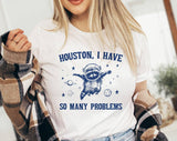"Houston, I Have So Many Problems" design on a white unisex t-shirt
