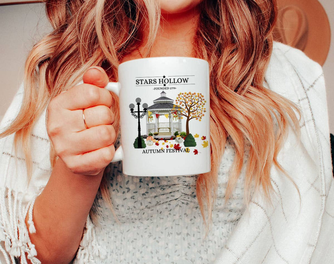 "Star Hollow" fall design on a white coffee mug