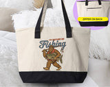 "I'd Rather Be Fishing Bigfoot" design on a natural canvas zippered tote bag