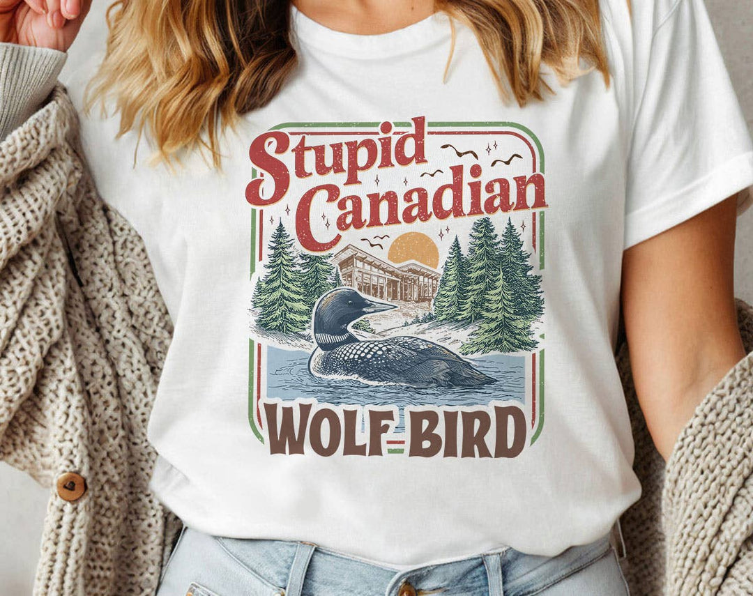 "Stupid Canadian Wolf Bird Heated Rivalry" design on a white unisex t-shirt