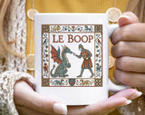 "Le Boop Dragon Knight" design on a white ceramic coffee mug