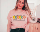 "It's Always A Good Day To Play Pickleball" design on a peach unisex t-shirt
