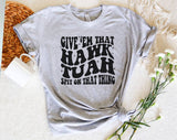 "Give 'Em That Hawk Tuah" design on a heather gray unisex t-shirt