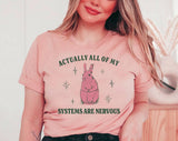 "All Of My Systems Are Nervous Bunny" design on a peach unisex t-shirt
