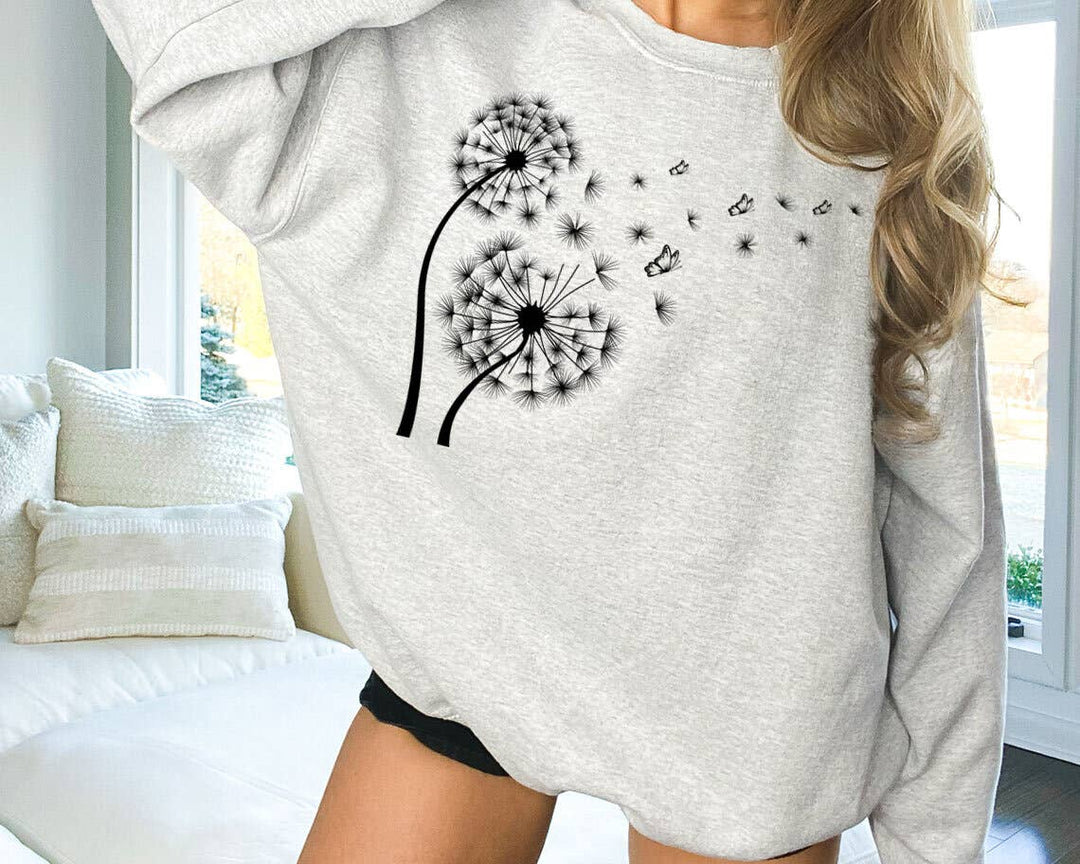 "Dandelion In The Wind" design on an ash gray unisex crewneck sweatshirt