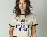 "Reading Is My Favorite Sport" design on a natural ringer t-shirt with black contrast trim