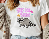 "See You Soon Raccoon" design on a white unisex t-shirt