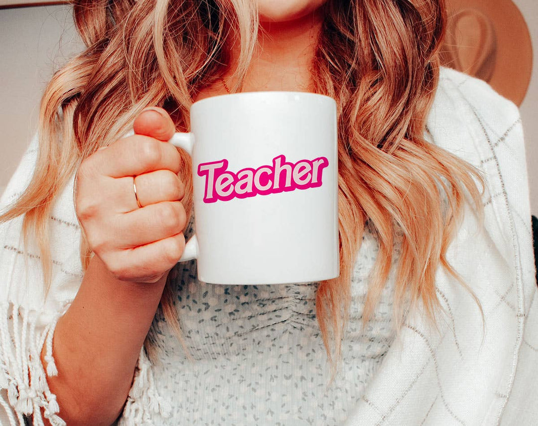 "Teacher" design on a white ceramic coffee mug