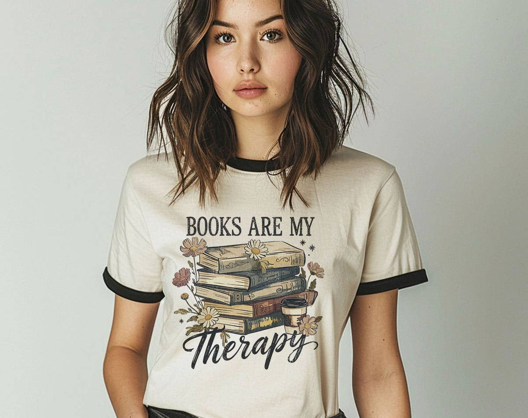 "Books Are My Therapy" design on a natural ringer t-shirt with black contrast trim