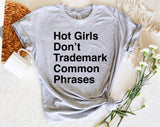 "Hot Girls Don't Trademark Common Phrases" design on a heather gray unisex t-shirt