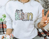 "He Is Risen Matthew 28:6" design on an ash gray unisex crewneck sweatshirt