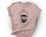 "Moon Magic Mushroom" design on a peach unisex t-shirt