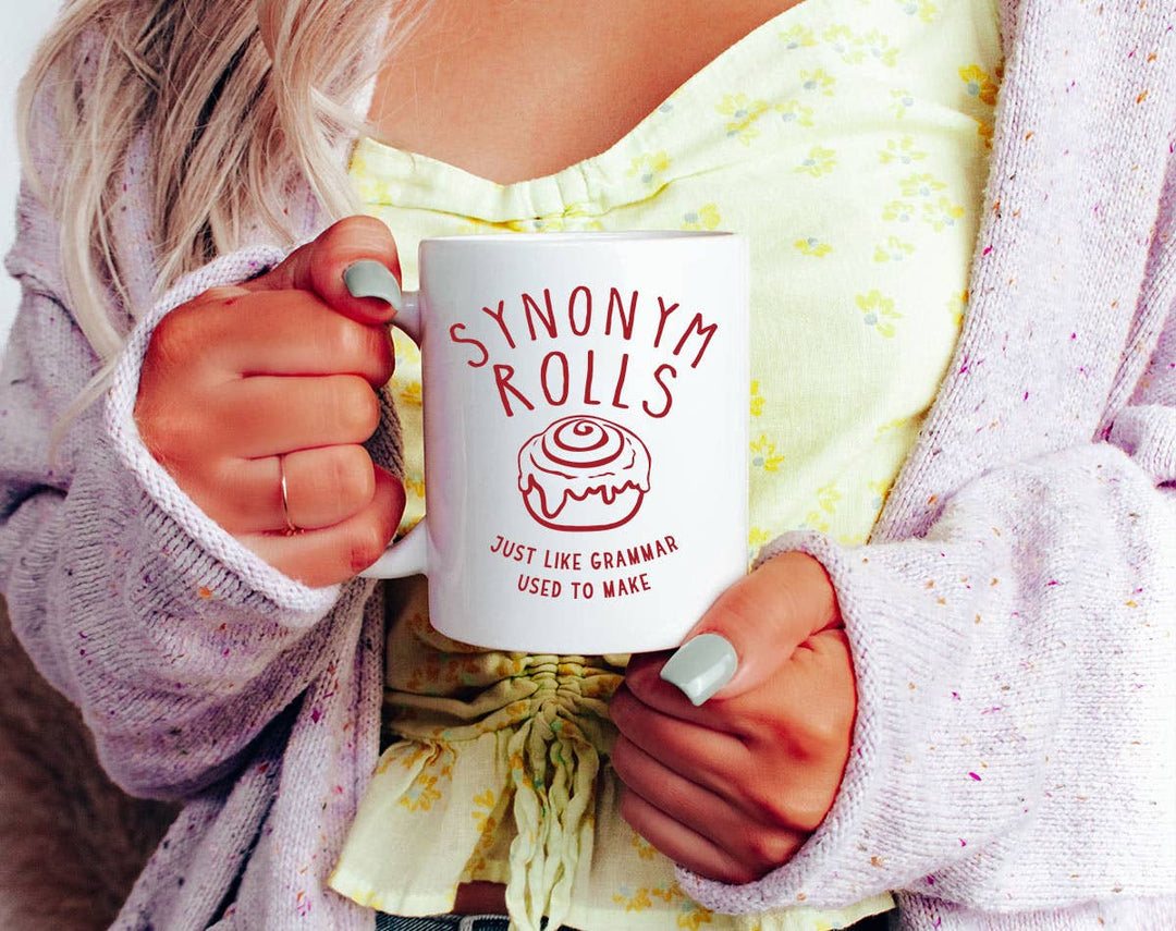 "Synonym Rolls" design on a white ceramic coffee mug
