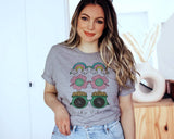 "Lucky Vibes Gold Rainbow" design on a heather gray unisex t-shirt