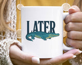 "Later Alligator" design on a white ceramic coffee mug
