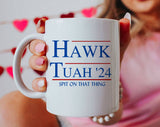 "Hawk Tuah 2024 Spit On That Thang" design on a white ceramic coffee mug
