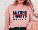 "Anyone Under 80" design on a peach unisex t-shirt