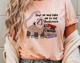 "Shut Up And Take Me To The Bookstore" design on a peach unisex t-shirt