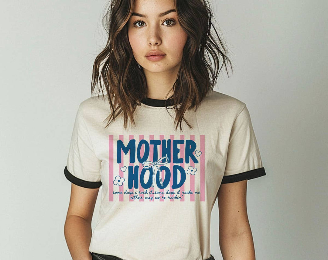 "Motherhood Some Days I Rock It" design on a natural ringer t-shirt with black contrast trim