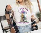 "At Least My Trauma Made Me" design on a white unisex t-shirt