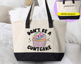 "Don't Be A Cuntcake" design on a natural canvas zippered tote bag