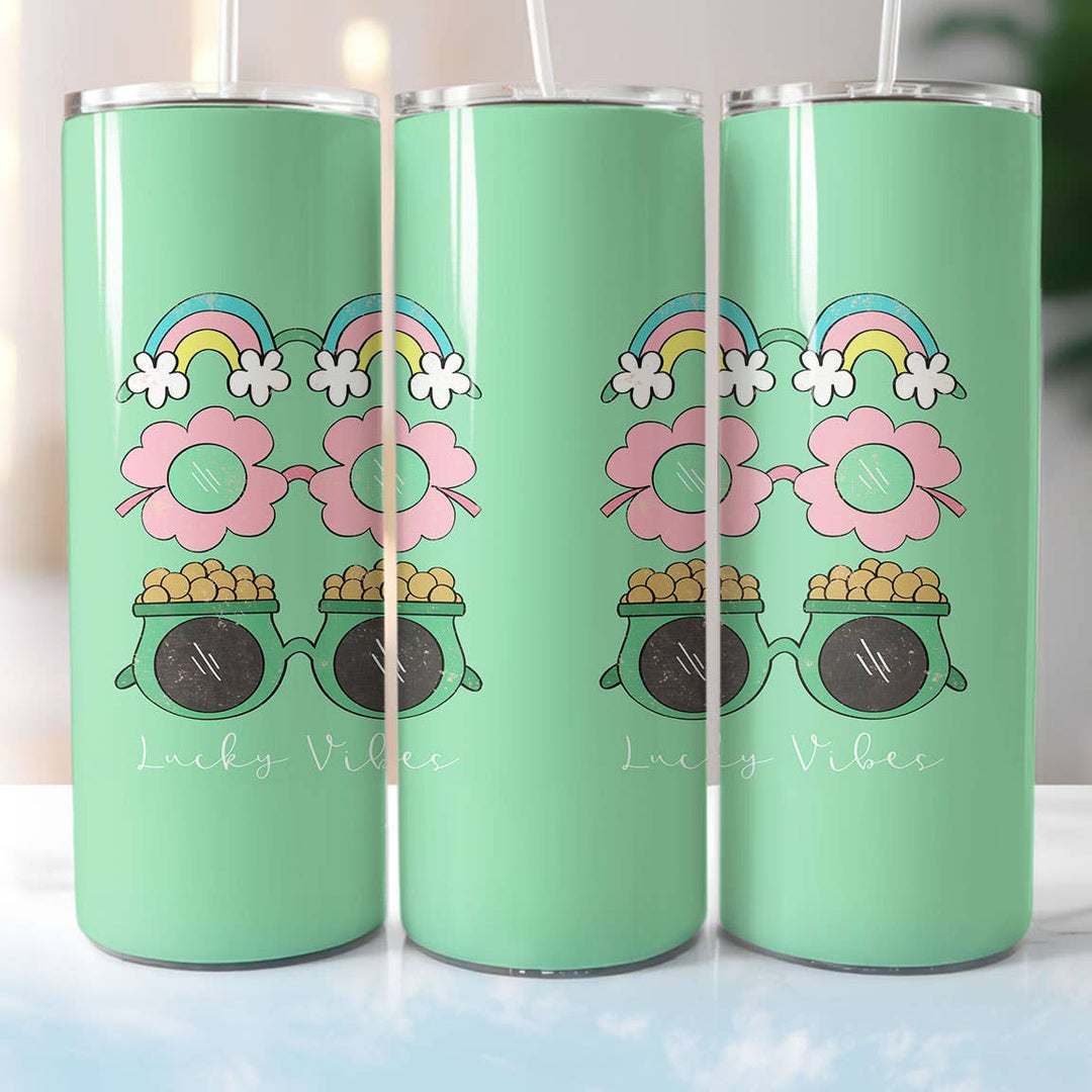 "Lucky Vibes" design on a 20 oz skinny tumbler with lid and straw