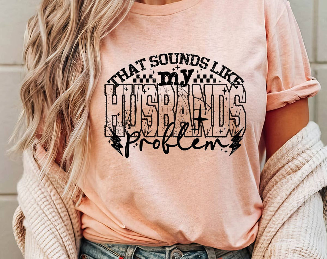 "That Sounds Like My Husband's Problem" design on a peach unisex t-shirt