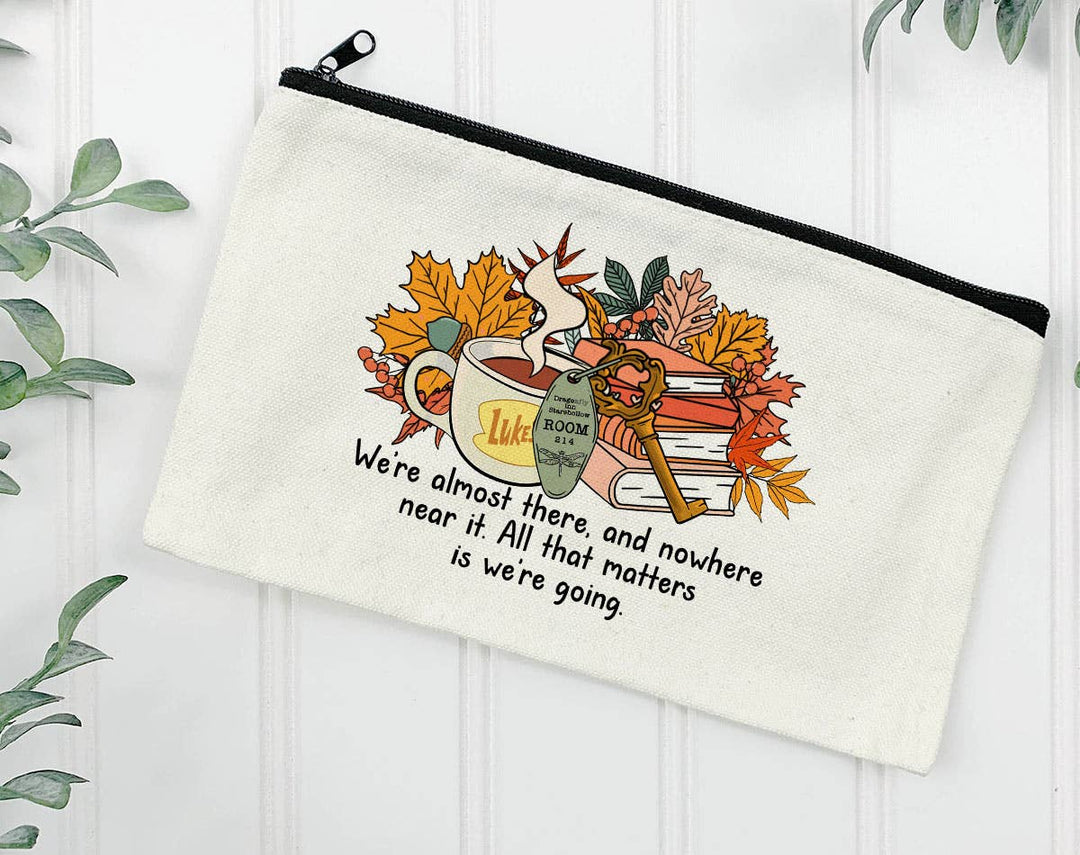 "We're Almost There Gilmore Girls" design on a natural canvas zipper makeup bag