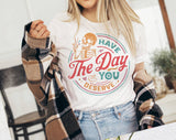 "Have The Day You Deserve" design on a white unisex t-shirt