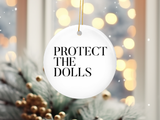 "Protect The Dolls Trans Rights" design on a 2.5 inch round ceramic Christmas ornament
