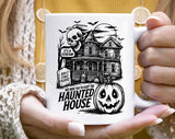"Haunted House We Dare You" Halloween design on a white coffee mug