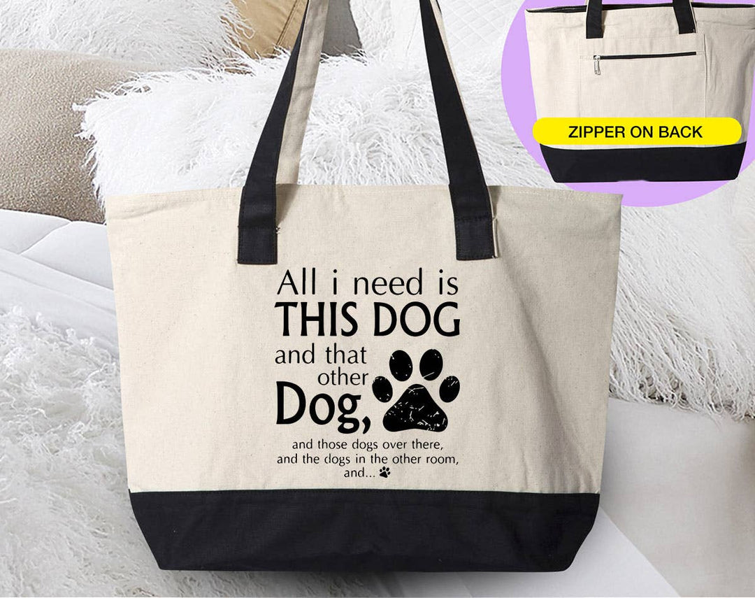 "All I Need Is This Dog And That Dog" design on a natural canvas zippered tote bag