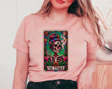 "The Stoner Tarot Skeleton" design on a peach unisex t-shirt