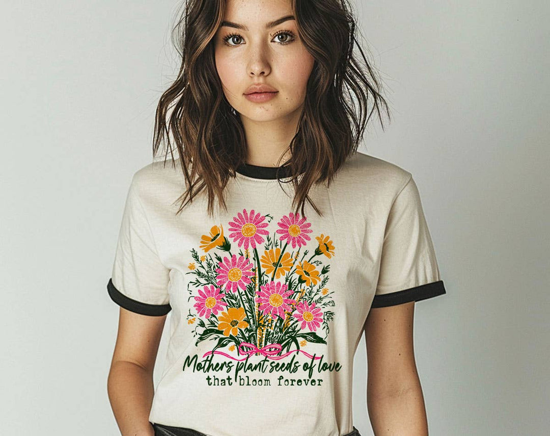 "Mothers Plant Seeds Of Love" design on a natural ringer t-shirt with black contrast trim