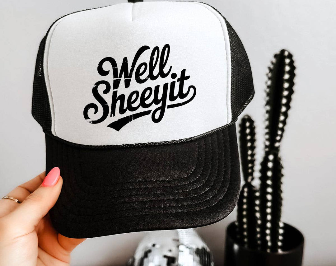 "Well Sheeyit" design on a mesh-back snapback trucker hat