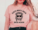 "Guess Who's Back Again Jesus" design on a peach unisex t-shirt