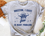"Houston, I Have So Many Problems" design on a heather gray unisex t-shirt