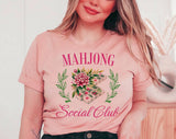 "Mahjong Social Club" design on a peach unisex t-shirt