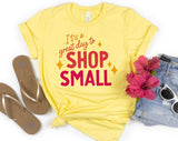 "It's A Great Day To Shop Small" design on a pale yellow unisex t-shirt