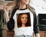 "Disgusted Doll Face Meme" design on a white baseball raglan tee with black sleeves