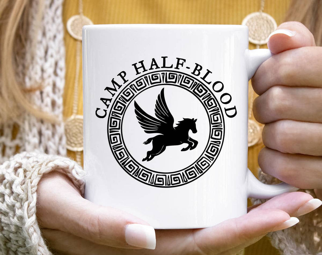 "Camp Half Blood" design on a white ceramic coffee mug