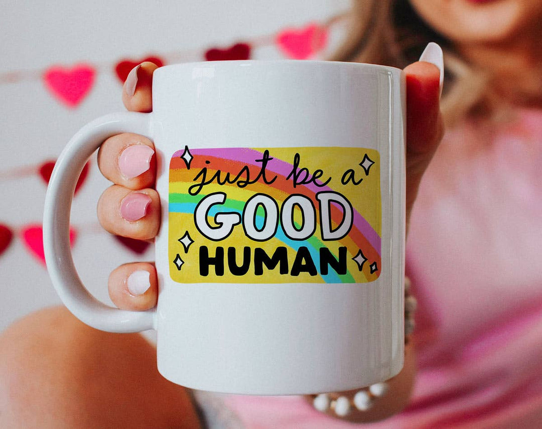 "Just Be A Good Human 2025" design on a white ceramic coffee mug
