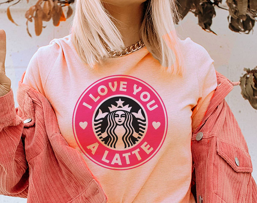 "I Love You A Latte Pink Coffee Logo" design on a peach unisex t-shirt