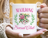 "Mahjong Social Club" design on a white ceramic coffee mug