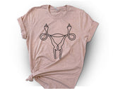 "Middle Finger Uterus" design on a peach unisex t-shirt