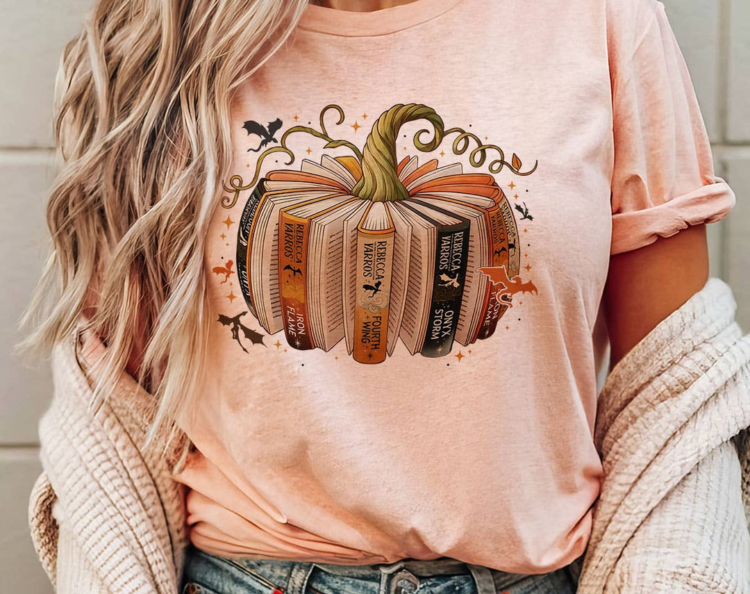 "Fourth Wing Pumpkin Book" design on a peach unisex t-shirt