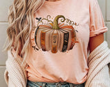 "Fourth Wing Pumpkin Book" design on a peach unisex t-shirt