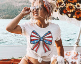 "Coquette Bow American Flag" design on a white unisex t-shirt