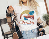 "Surf Arrakis" design on a white unisex t-shirt
