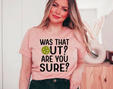 "Was That Out? Are You Sure? Pickleball" design on a peach unisex t-shirt
